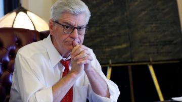 Former Mississippi governor sues news site over welfare fraud comments