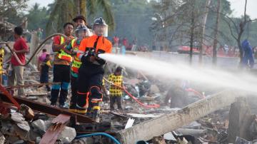 A large explosion at a fireworks warehouse in Thailand kills at least 10 people and wounds scores