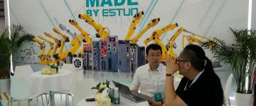AP PHOTOS: Lifelike robots and android dogs wow visitors at Beijing robotics fair