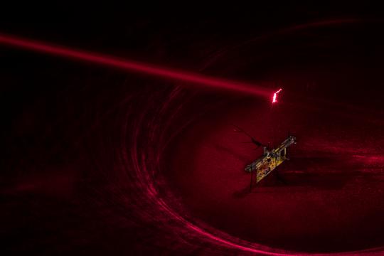 Watch a laser-powered RoboFly flap its tiny wings