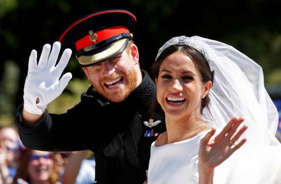 Sealed with a kiss - newlyweds Harry and Meghan delight Windsor crowds
