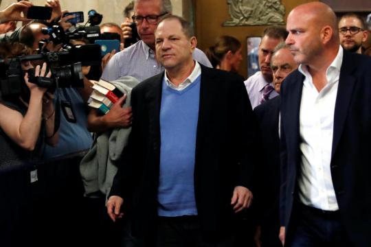 Film mogul Weinstein appears handcuffed in court to face rape charges