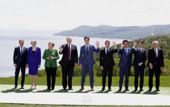 Germany's Merkel offers way to solve trade row at tense G7 summit