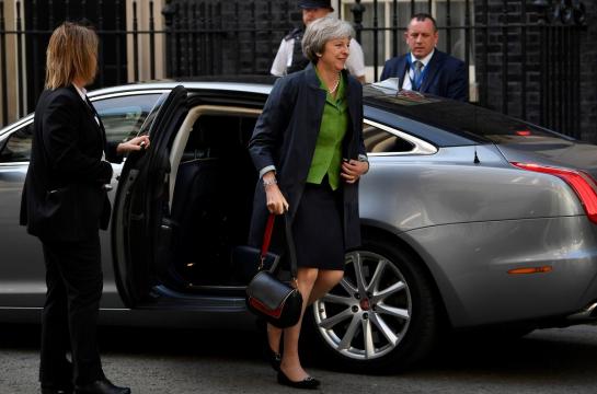 May faces another day of Brexit compromise in parliament