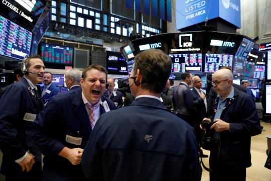 Wall Street flat, media stocks jump after AT&T ruling