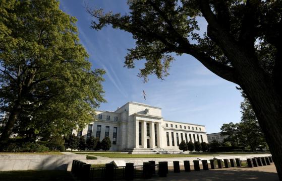 Fed lifts rates amid stronger inflation, drops crisis-era guidance