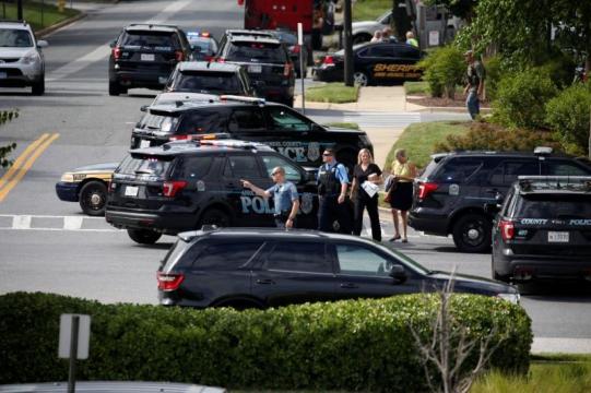 Gunman held, newspaper publishes a day after five killed in newsroom