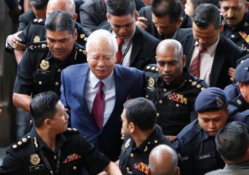 Former Malaysian PM pleads not guilty to charges in 1MDB graft probe