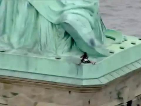 Statue of Liberty Scaled By Woman on 4th To Protest Trump's Family Separation