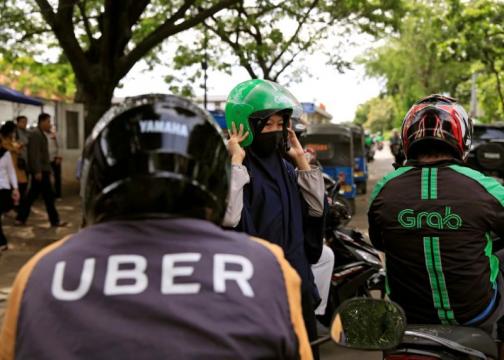 Singapore says Grab-Uber merger lessened competition, proposes penalties