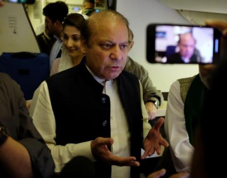 Poll tension grips Pakistan as ousted PM flies home to face jail