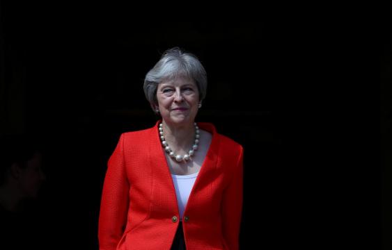 May wins parliament vote after bowing to Brexit pressure