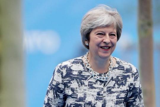 After reprieve, May faces Brexit battle in parliament on trade