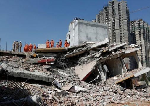 Building collapse in Delhi suburb kills at least two, more feared dead