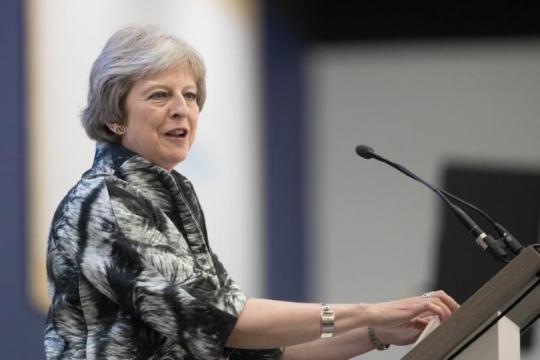 May to visit Northern Ireland to offer Brexit reassurances