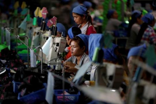 Hardworking Cambodian shoe maker has little time for politics