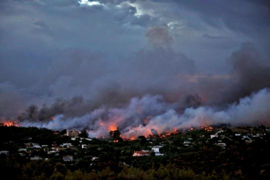 Greek wildfire kills at least 24 near Athens, residents flee homes