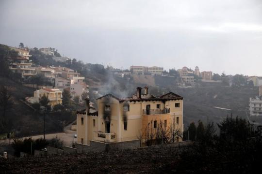 Wildfire kills at least 50 near Athens, families flee to beaches