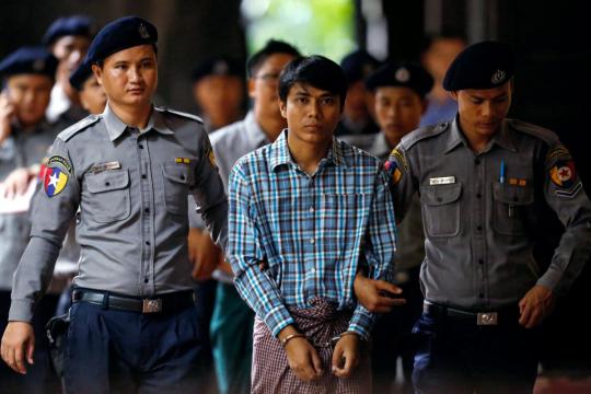 Black hoods, kneeling, no sleep: Reuters reporter details Myanmar custody