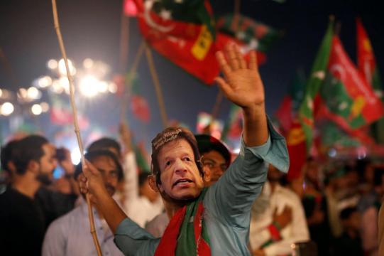 Pakistan votes in tight race between Imran Khan, jailed ex-PM's party