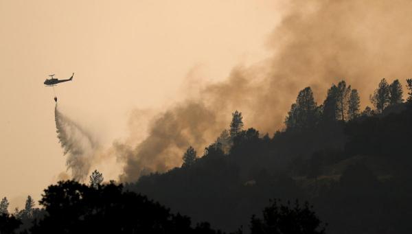 California 'Tasmanian devil' fire kills 2 firefighters, thousands flee
