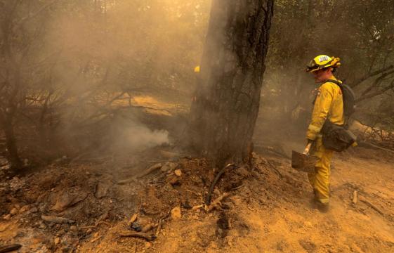 Firefighters gain on massive California wildfire, six dead