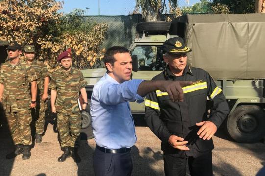 Greek PM meets survivors in fire-stricken town after criticism