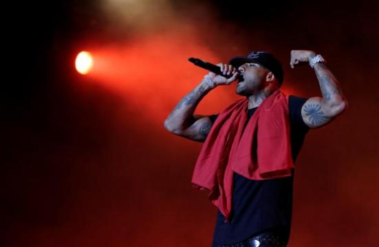 Celebrity rappers ordered held in custody for a month pending trial after French airport brawl