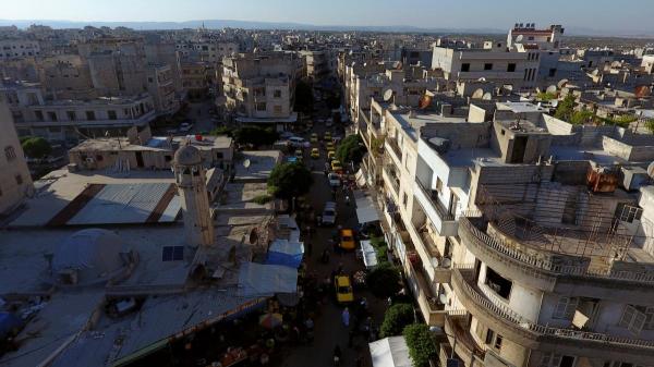 Wave of strikes hits Syria's last rebel-held bastion