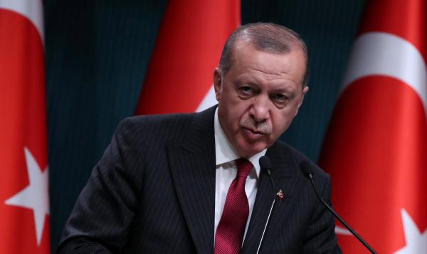 Defiant Erdogan casts Turkey currency crisis in religious, patriotic terms