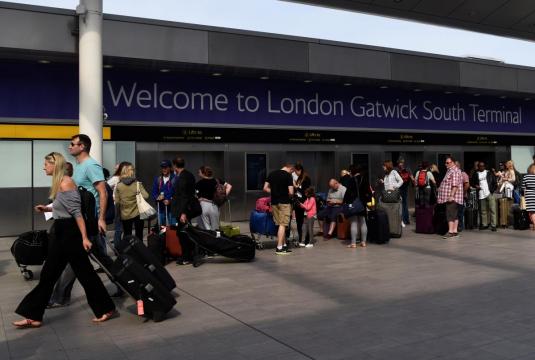 Gatwick, UK's no.2 airport, shows flights on white boards after IT fails