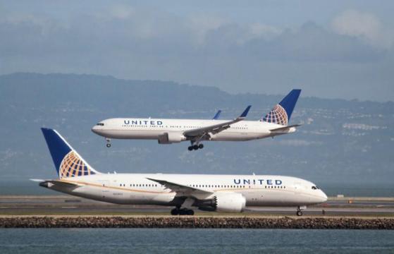 United Continental raises fees for checked bags on certain routes