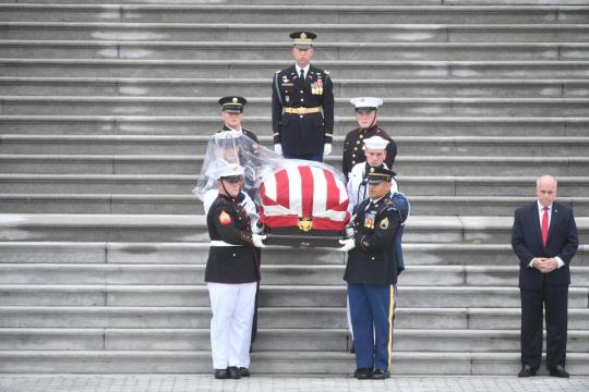 McCain motorcade departs U.S. Capitol en route to cathedral