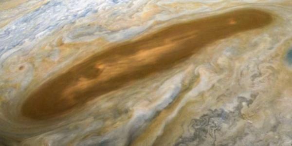 Juno orbiter’s view of a beautiful brownish spot on Jupiter sparks a bit of potty humor