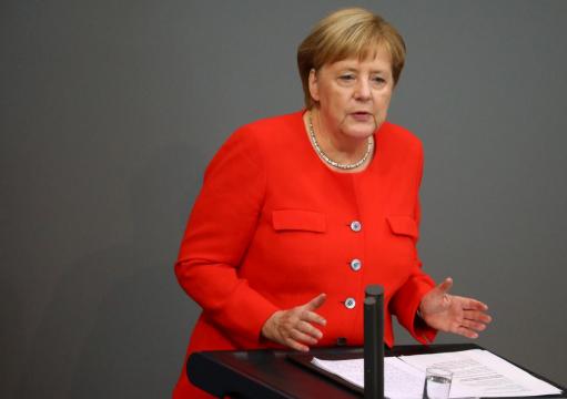 Merkel: No excuse for hunting people down, Nazi slogans