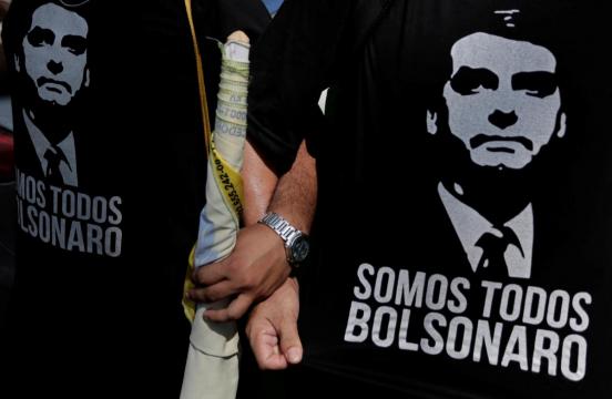 Brazil candidate Bolsonaro attacks Workers Party from hospital bed