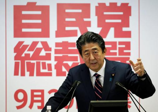 Japan PM Abe wins extended term, faces Trump trade challenge