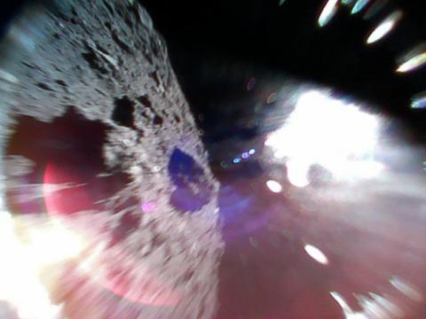 Japanese mini-rovers send back their first images as they hop around an asteroid
