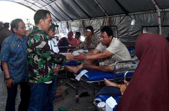 Indonesia rushes to help quake-hit island, death toll likely to rise past 830