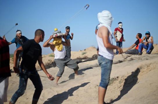 Israel reinforces troops outside Gaza as border protests enter seventh month