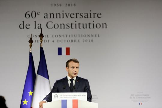 In political storm, Macron wraps himself in de Gaulle's constitution, style