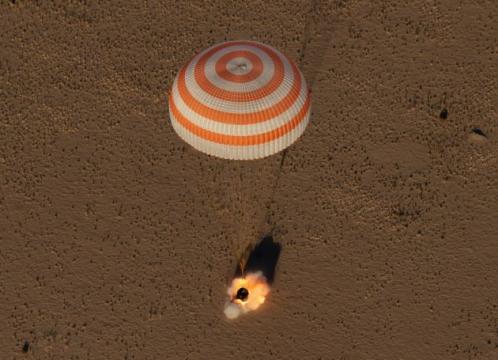 U.S.-Russian trio returns to Earth from space station on Sputnik anniversary