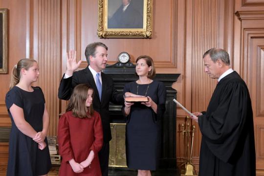After fight that split U.S., Kavanaugh wins place on Supreme Court
