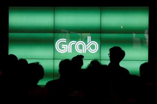 Philippine watchdog fines Grab, Uber for rushed merger, drop in service quality