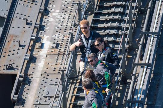 Prince Harry scales Sydney Harbour Bridge, joins group hug at Bondi