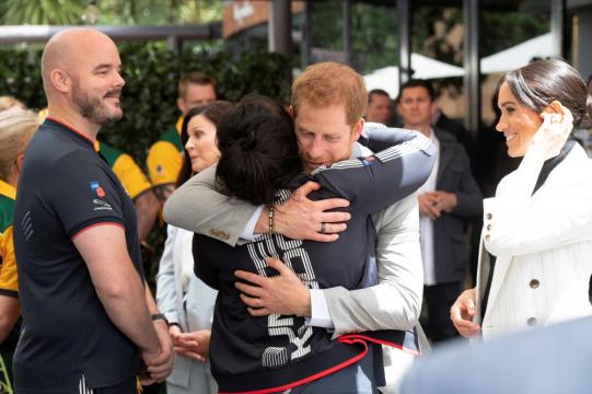 Prince Harry inspires athletes as pregnant Meghan trims Australia schedule