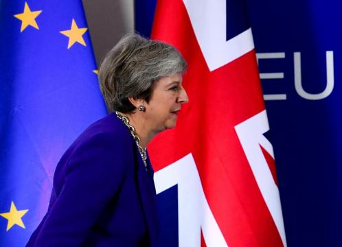May tries to calm Brexit rebels, says deal almost done
