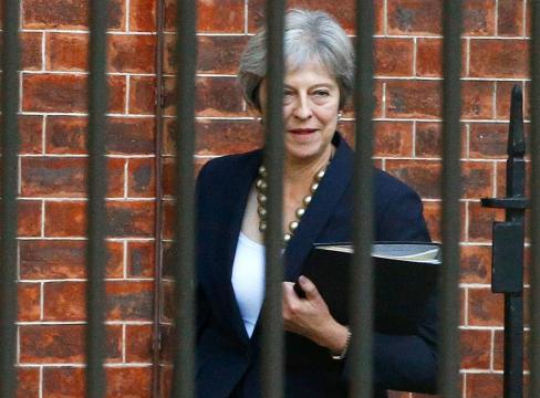 May to address her MPs on Wednesday after attacks over Brexit
