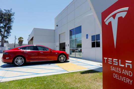 Tesla may post profit with Model 3 surge, investors look for more