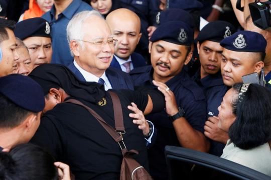 Former Malaysian PM Najib, ex-treasury chief charged with criminal breach of trust